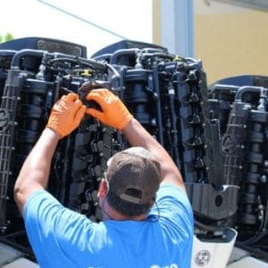 Marine tech servicing outboard engines