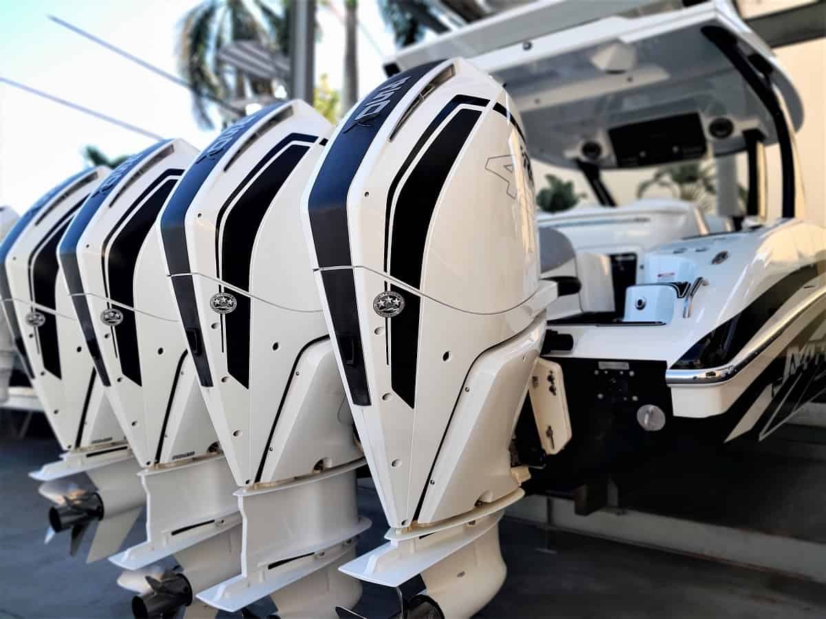 Large boat with quadruple Mercury Racing outboard engines in dry rack storage